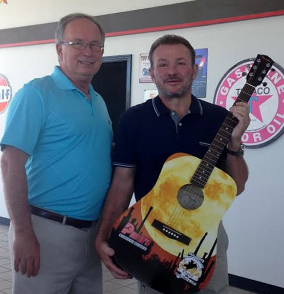 Mayor Philip Craighead presents a Commemorative Guitar to Platinum Sponsor Bobby Price of Price’s Collision Centers