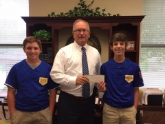Mayor Craighead presents a check from the 7th Annual Charity Whip Crackin’ Rodeo to the Lebanon Youth Baseball League.  The team qualified for the Dixie Youth World Series. The series kicks off on August 6th in Laurel, Mississippi.