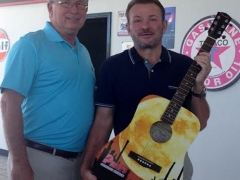 Mayor Philip Craighead presents a Commemorative Guitar to Platinum Sponsor Bobby Price of Price’s Collision Centers